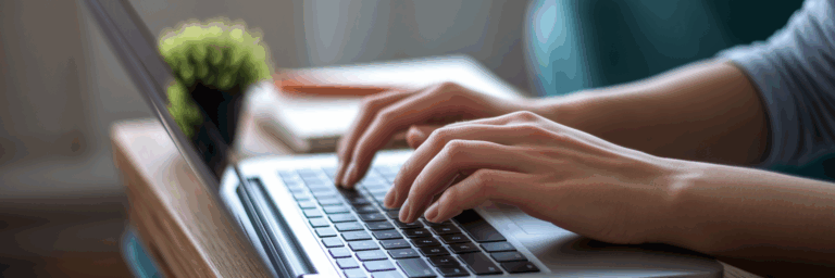 Person typing on laptop creating affiliate content.